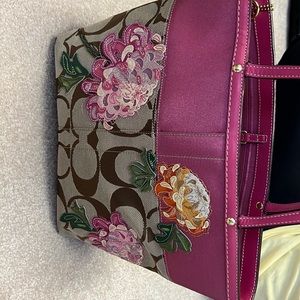 Coach purse with embroidered pink flowers. Cute for spring time
